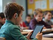 © Alex Pios - Student with hearing aid using tablet and speech-to-text app in an inclusive classroom learning environment.
