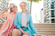 © halayalex - Two young beautiful smiling hipster female in trendy summer clothes and dress.Sexy carefree women posing on the street background. Positive pure models having fun at sunset, hugging and going crazy