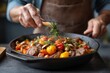 © Nongkran - Freshly Prepared Colorful Vegetable and Meat Dish in Skillet Steaming with Flavorful Herbs