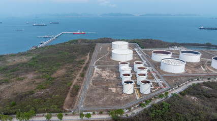 Fototapete - Oil terminal industrial facility storage tank, Oil storage tank with oil terminal port loading arm cargo oil product tanker ship, Global business refinery industry commercial port.