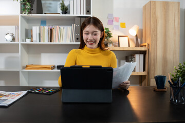Designer woman thinking ideas strategy about mobile app interface wireframe design with customer breif and color code, User experience concept.