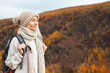 © Tatyana Gladskih - Middle Aged Woman with backpack walking in the autumn forest trip