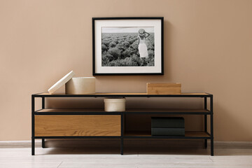 Aufkleber - Console table and decor near dark beige wall in room. Interior design