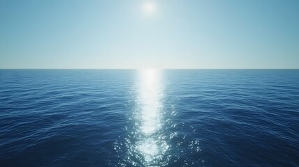 ocean water surface shimmers under bright sun on clear blue sky