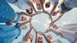 © Довидович Михаил - School friends joining hands in a circle under a clear blue sky, displaying teamwork and togetherness
