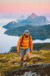 © EVERST - Man trail running in mountains of Norway solo travel hiking adventure outdoor, active people healthy lifestyle summer vacations athlete sport training, sunset islands and sea landscape