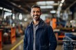© NikoG - confident smiling man portrait in a factory worker