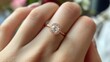 © shobakhul - A person wearing a sparkling ring on a finger