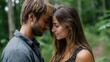 © Mykhailo - Close-up of young couple with foreheads touching in a forest, showing intimacy and tenderness