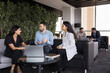 © fizkes - Three teammates lead talk seated in office lounge area, engaged in focused conversation, collaborate on joint task, brainstorming or reviewing work-related matter. Teamwork, professional communication