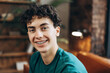 © Maria Vitkovska - Close up of positive teenage boy with braces wearing t shirt posing at camera