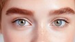 © Giman - Close-up of expressive eyes, highlighting delicate features.  Natural beauty, with light skin and subtle freckles, and well-defined eyebrows