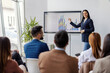 © Dusan Petkovic - Young businesswoman showing data on panel while standing at conference room and having presentation.
