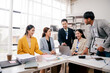 © Dino - Brainstorming of young modern group. Team meeting to achieve goal. Business people discussing finance business and analysis. Teamwork concept in modern office. Calculating personal tax for client.