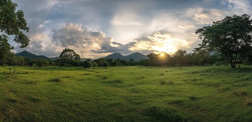 Wall Mural - A beautiful green landscape of a mountain range with trees and sky at sunset in the southern region of Thailand. A Sri Lankan nature view with a beautiful cloudscape. 