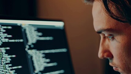 Aufkleber - Dedicated software developer working intensely, typing programming code on computer screen, bathed in monitor light inside dimly illuminated workspace during late night hours