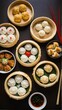 © Kasivat - A Delicious Collection of Dumplings: Steamed Buns, Potstickers, and More, Presented in Bamboo Steamers on a Dark Wood Table.