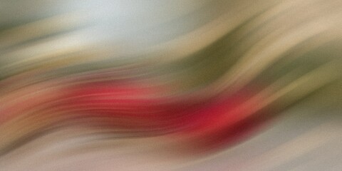Wall Mural - abstract blurred image featuring a dominant red color with hints of green and beige tones present to