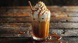 Close-up of Iced Caramel Macchiato with Whipped Cream and Syrup on Wooden Table Background