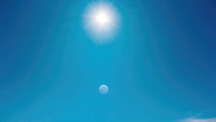 Wall Mural - radiant sun shining against a clear blue sky with open space