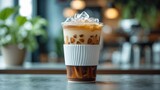 Disposable cup holding Dutch coffee for a cold brew drink