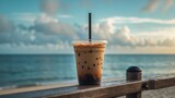 Tropical iced black coffee americano in a take away cup with beach background
