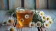 ©  AugmentArt - Chamomile flower herbal tea served on a table