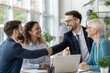 © DND - Business professionals shaking hands with colleagues after a successful meeting, celebrating teamwork and collaboration. (People)