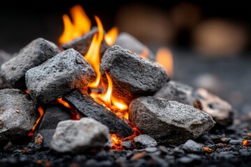 Leinwandbilder - Flames dancing over glowing charcoal stones create a warm atmosphere during a night gathering outdoors