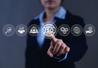 Fototapete - ISO certification and quality assurance standard concept. Businesswoman pointing at ISO certification icons, symbolizing global standards, compliance, excellence across operations, certified quality,