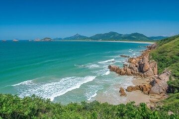 Aufkleber - Serene coastal view showcasing clear blue waters and lush green cliffs under a bright sunny sky