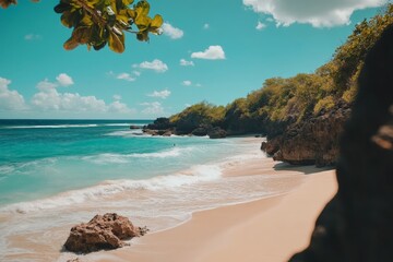 Aufkleber - Scenic coastal view showcasing clear waters and sandy beach under a blue sky with scattered clouds