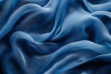 Leinwandbilder - Soft blue fabric draped elegantly on a surface showcasing its delicate folds and texture