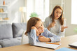 © Studio Romantic - Sad tired teenage boy unwilling to study at home, worried parent mom persuading helping comforting teen encouraging school son, having difficulty with school education, learning skill problems
