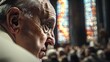 © Jannik - The Pope is in the cathedral, a side view of his face. A lot of people are behind him