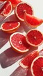 © Jersco - Vibrant grapefruit slices arranged artfully.