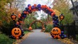 © Artittaya - Balloon arch gate with Halloween-themed balloon faces in festive colors