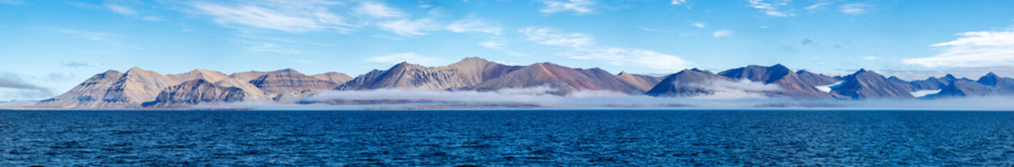 Wall Mural - wide panorama of the mountains of konsfjorden fjord, spitsbergen, svalbard. pristine landscape with 