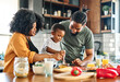 © Lumos sp - child family kitchen food boy son mother father breakfast preparing egg morning healthy diet eating home black african american father cooking parent cute meal kid