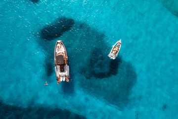Wall Mural - aerial view of beautiful luxury yacht and boat in blue sea in summer. sardinia, italy. top drone vie