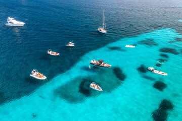 Wall Mural - aerial view of beautiful luxury yacht and boat in blue sea in summer. sardinia, italy. top drone vie