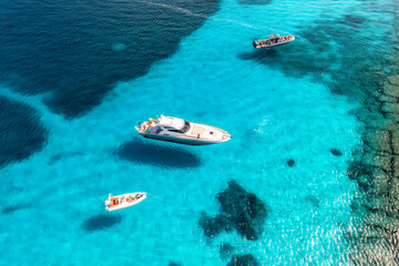 Wall Mural - aerial view of beautiful luxury yacht and boat in blue sea in summer. sardinia, italy. top drone vie