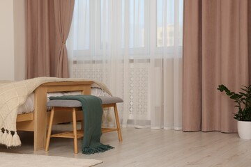 Poster - stylish room interior with comfortable bed and beautiful window curtains