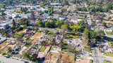 Aerial shot of fire damaged businesses and homes on Lake Street in Altadena California USA