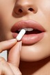 © Ant - A close-up of a woman's face holding a white pill near her lips, emphasizing beauty and health.