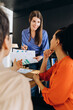 © Maria Vitkovska - Marketing professional explaining growth analysis to colleagues in meeting