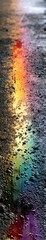Aufkleber - Rainbow Refraction Reflected in Oil Puddle on Asphalt Creating Vibrant Colors During a Rainy Day
