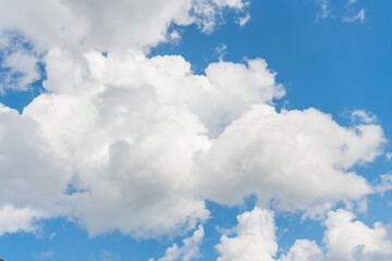 Wall Mural - Sky with white cloud. Beauty white cloudy on blue sky with soft sun light, Nature view soft white clouds on pastel blue sky background