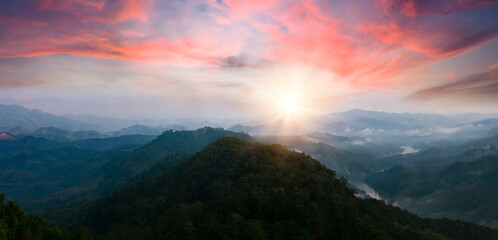 Wall Mural - panoramic view of beautiful sunrise over the mountain range, thailand