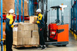 © SpaceOak - Warehouse Workers Loading Forklift.